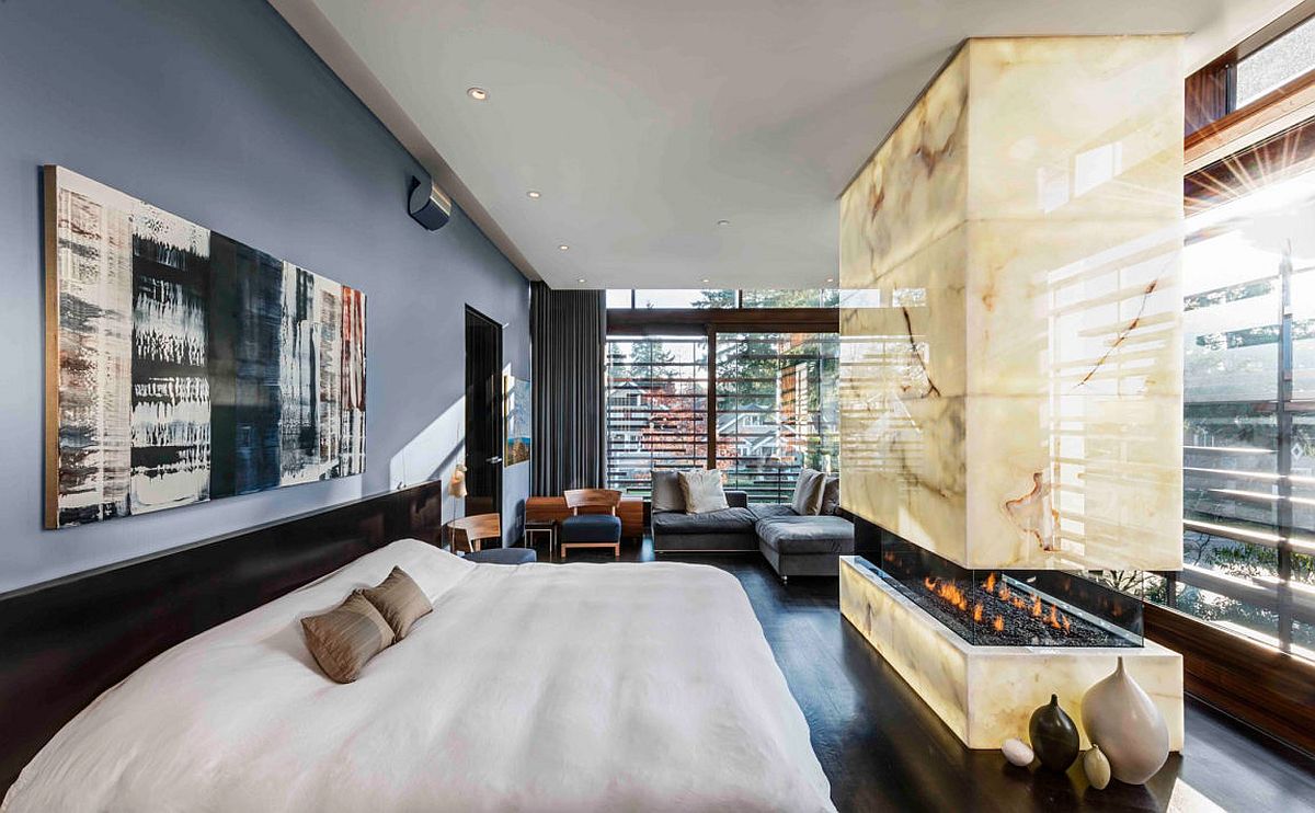 Sensational contemporary bedroom with a sizzling modern fireplace and ample luxury