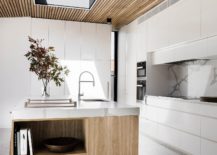 Skylight-brings-natural-ventilation-to-the-kitchen-with-wooden-ceiling-217x155