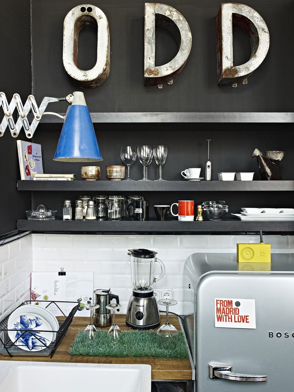 Sleek contemporary shelves in the black for the dark kitchenette