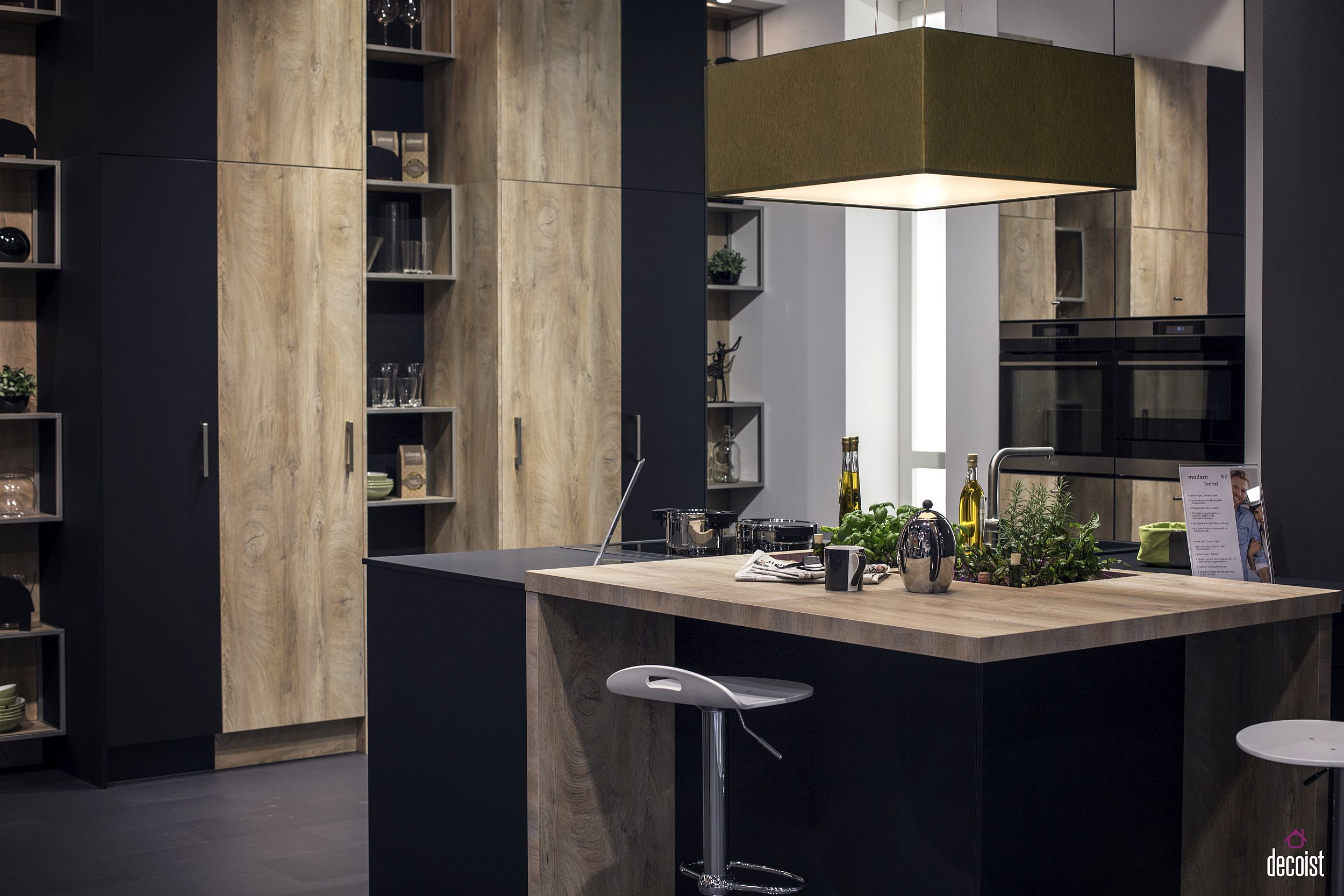 Small kitchen island with wooden and polished countertop sections and a uber-small breakfast bar