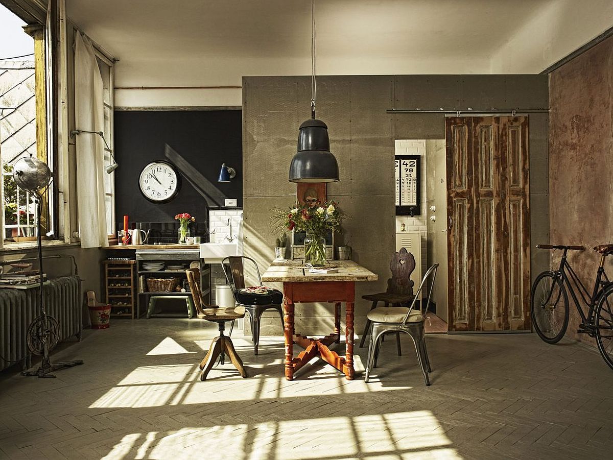 Small kitchenette in the corner with a chalkboard wall