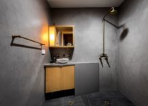 Space-savvy-and-minimal-bathroom-with-corner-sink-vanity-and-medicine-cabinet-217x155