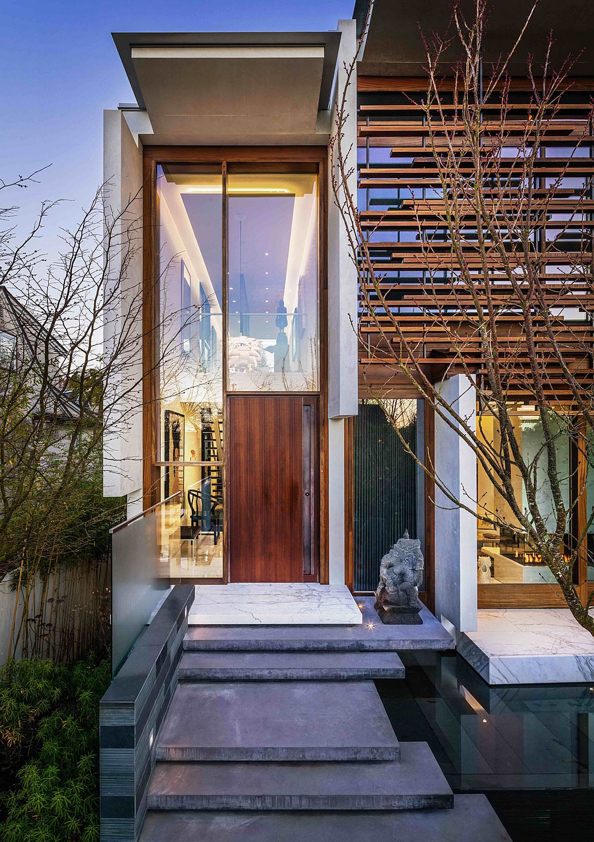 Stone-and-reflecting-pod-give-the-entrance-a-serene-inviting-vibe