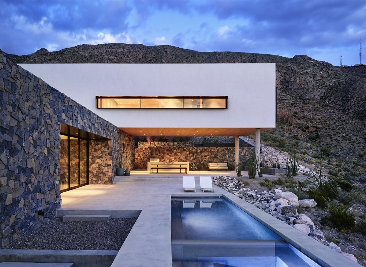 Stone and smooth troweled stucco shape the exterior of the El Paso home