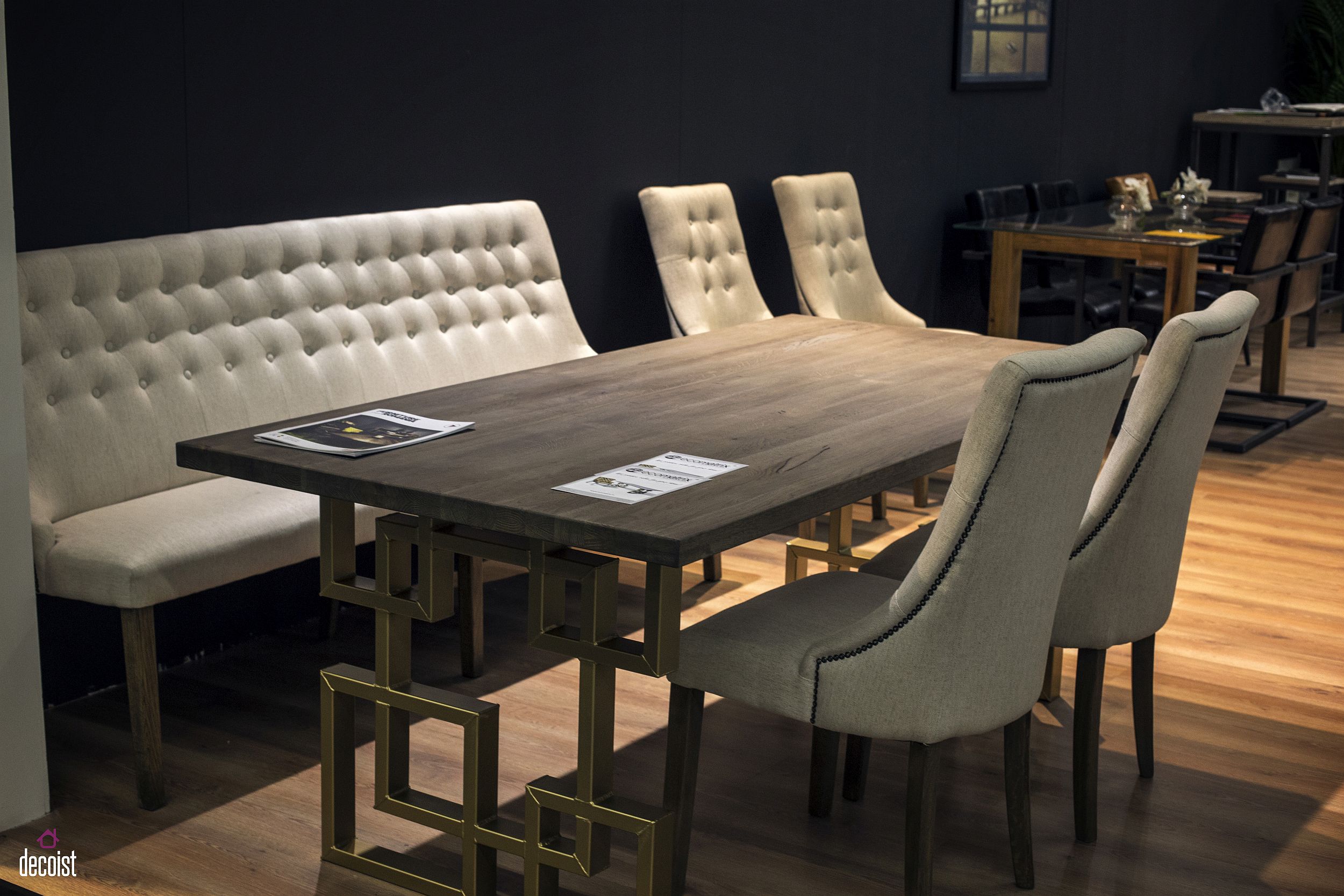 Tufted bench along with comfy chairs for the rustic modern dining room