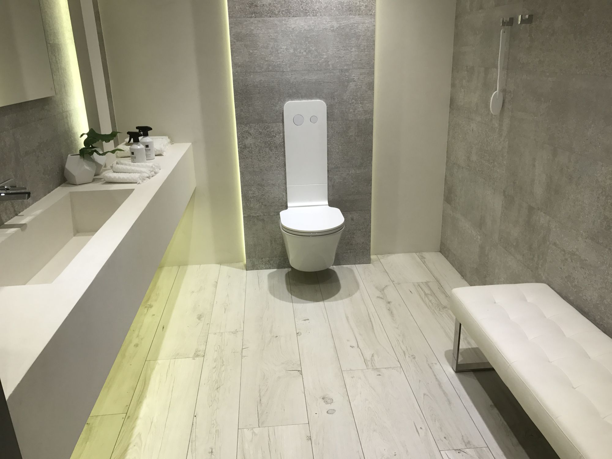 Wood inspired floor tiles in sleek modern bathroom design by Porcelanosa