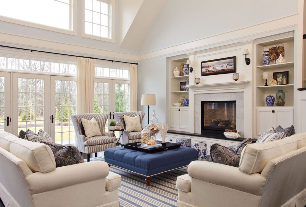 A navy blue ottoman within a beige living room