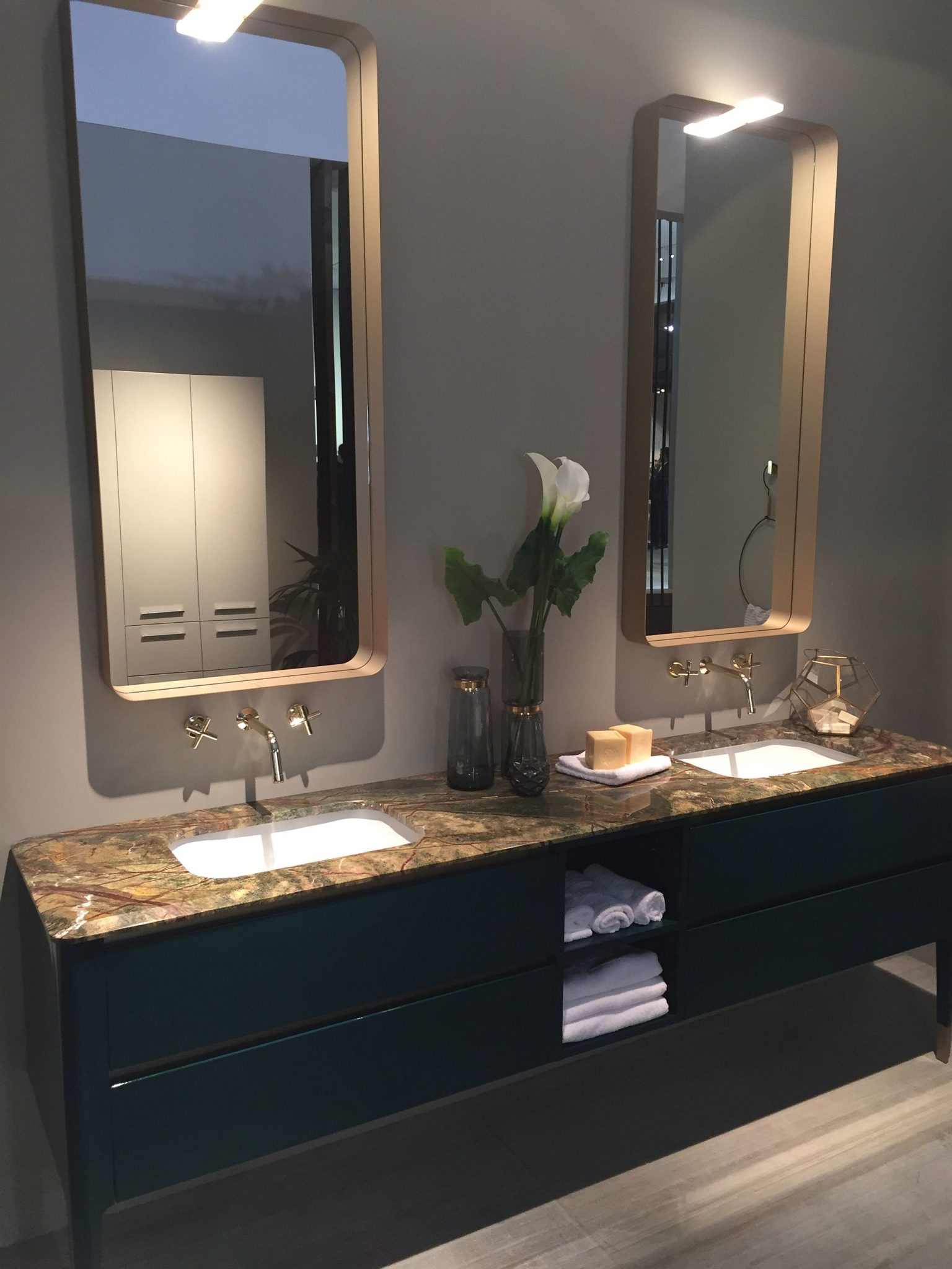 Bathroom vanity with open shelves offers ample space for a smart towel display