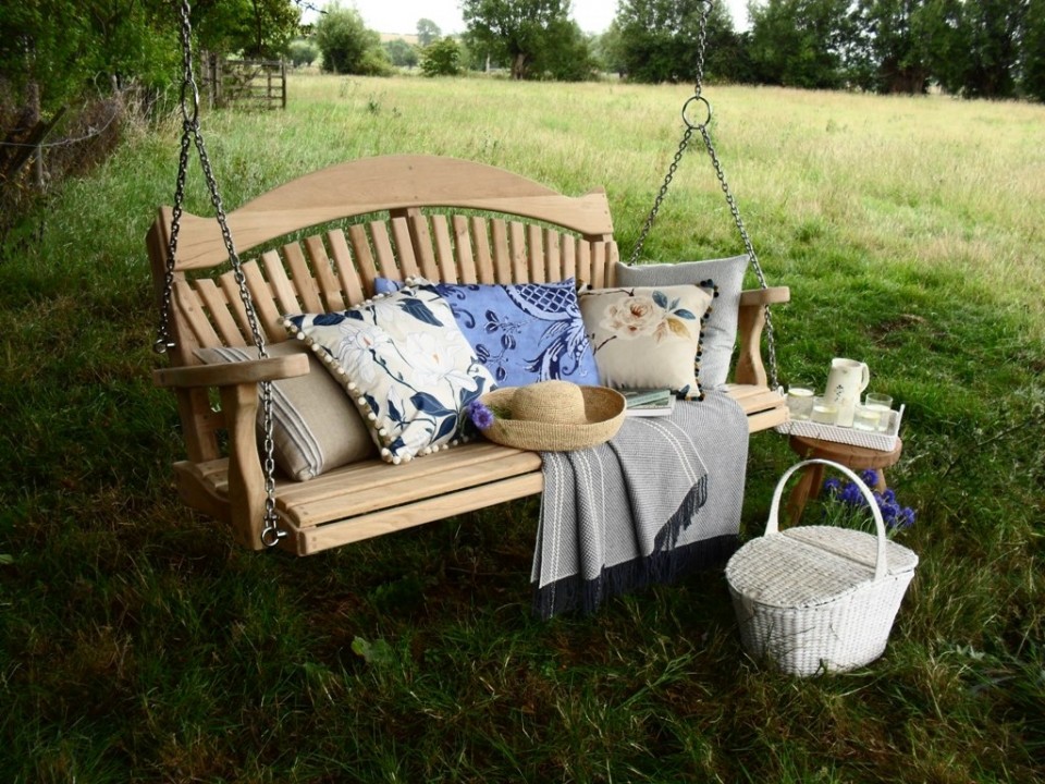 Big tree-hung garden swing ready for a picnic