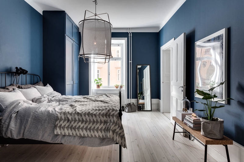 Blue bedroom with an interior that feels curious and enigmatic