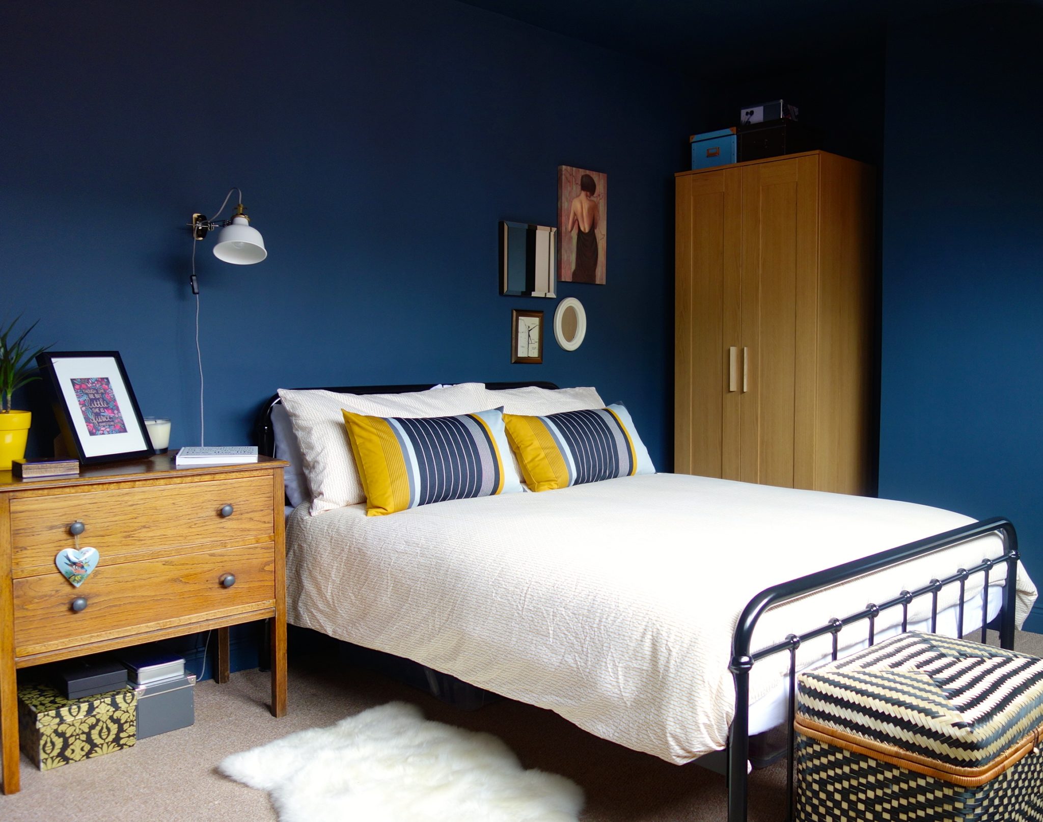 Blue bedroom with colorful decor pieces