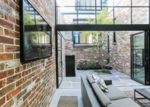 Brick-steel-and-concrete-preserve-the-industrial-appeal-of-the-garage-home-217x155