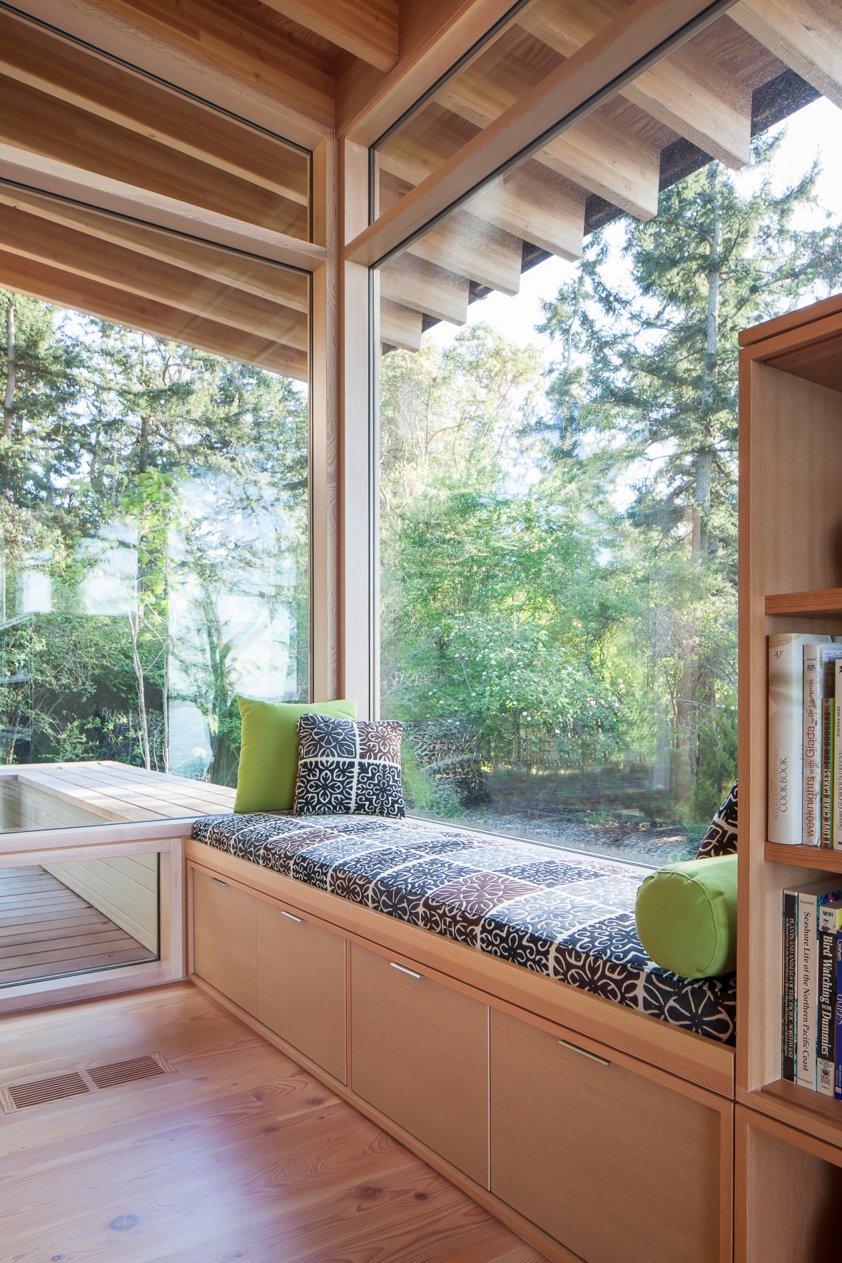 Bright wooden window seat reading nook