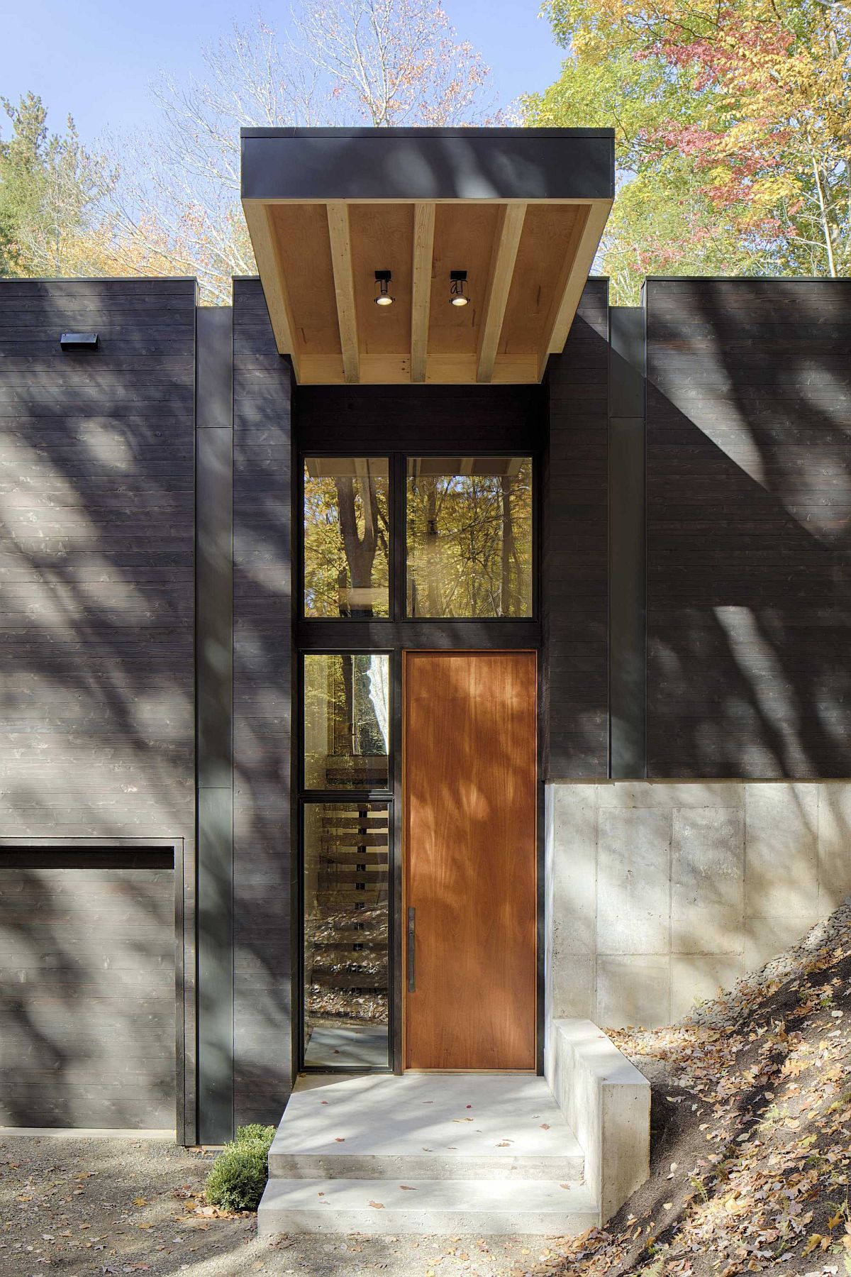 Cantilevered portion of the house offers natural shade to the entry