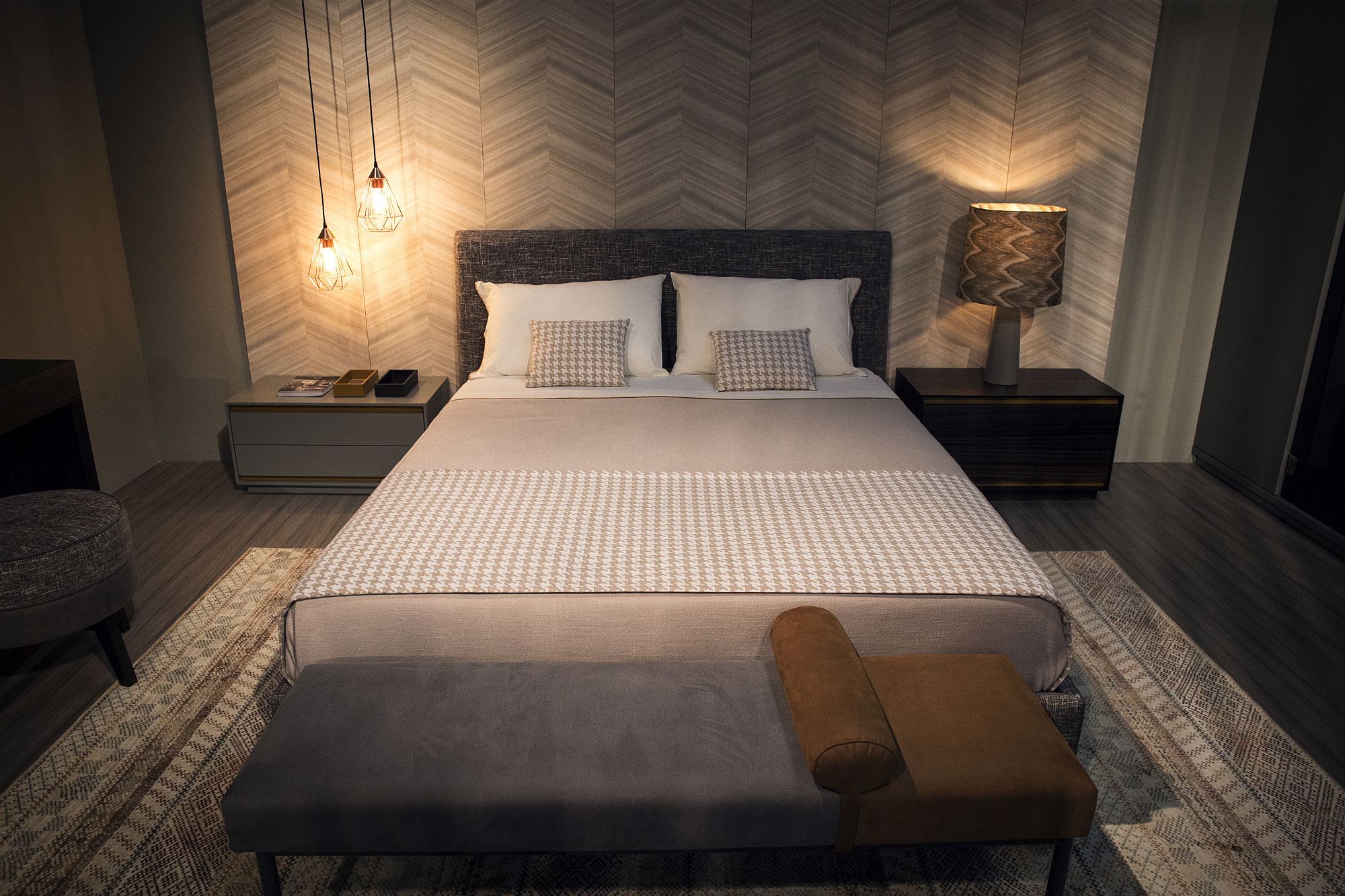 Chevron pattern in the backdrop bring geo style to the cool bedroom