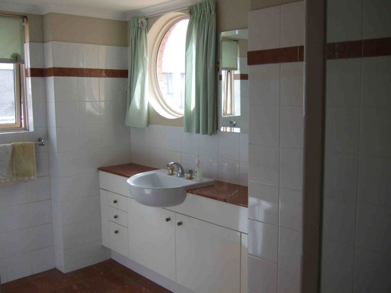 Chic bathroom with a stunning round window