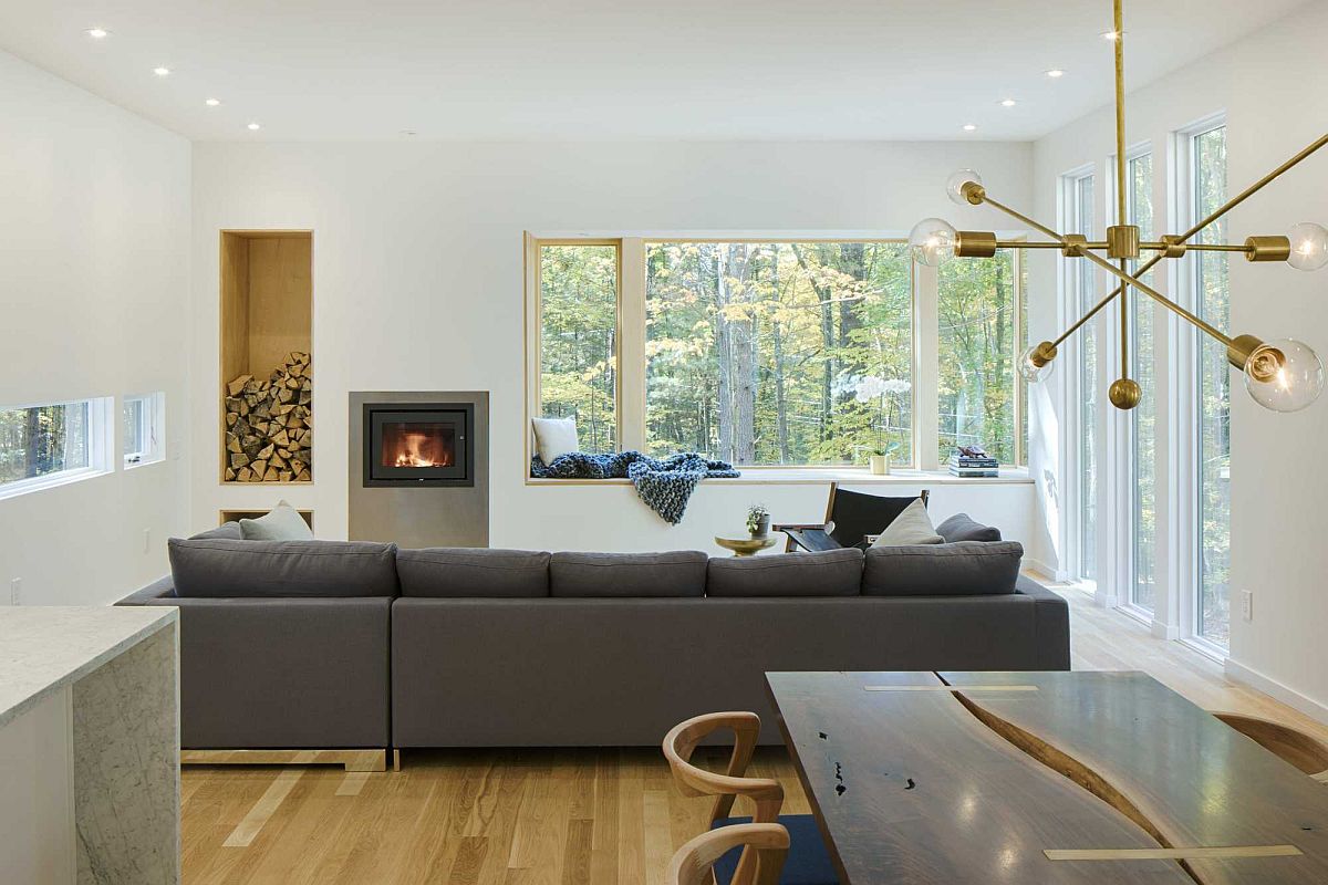 Comfy-window-seat-creates-a-space-savvy-redaing-nook-with-a-view-of-the-forest-outside