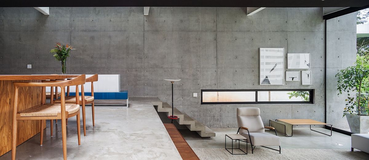 Concrete-wall-in-the-backdrop-creates-a-neutral-setting-with-texture