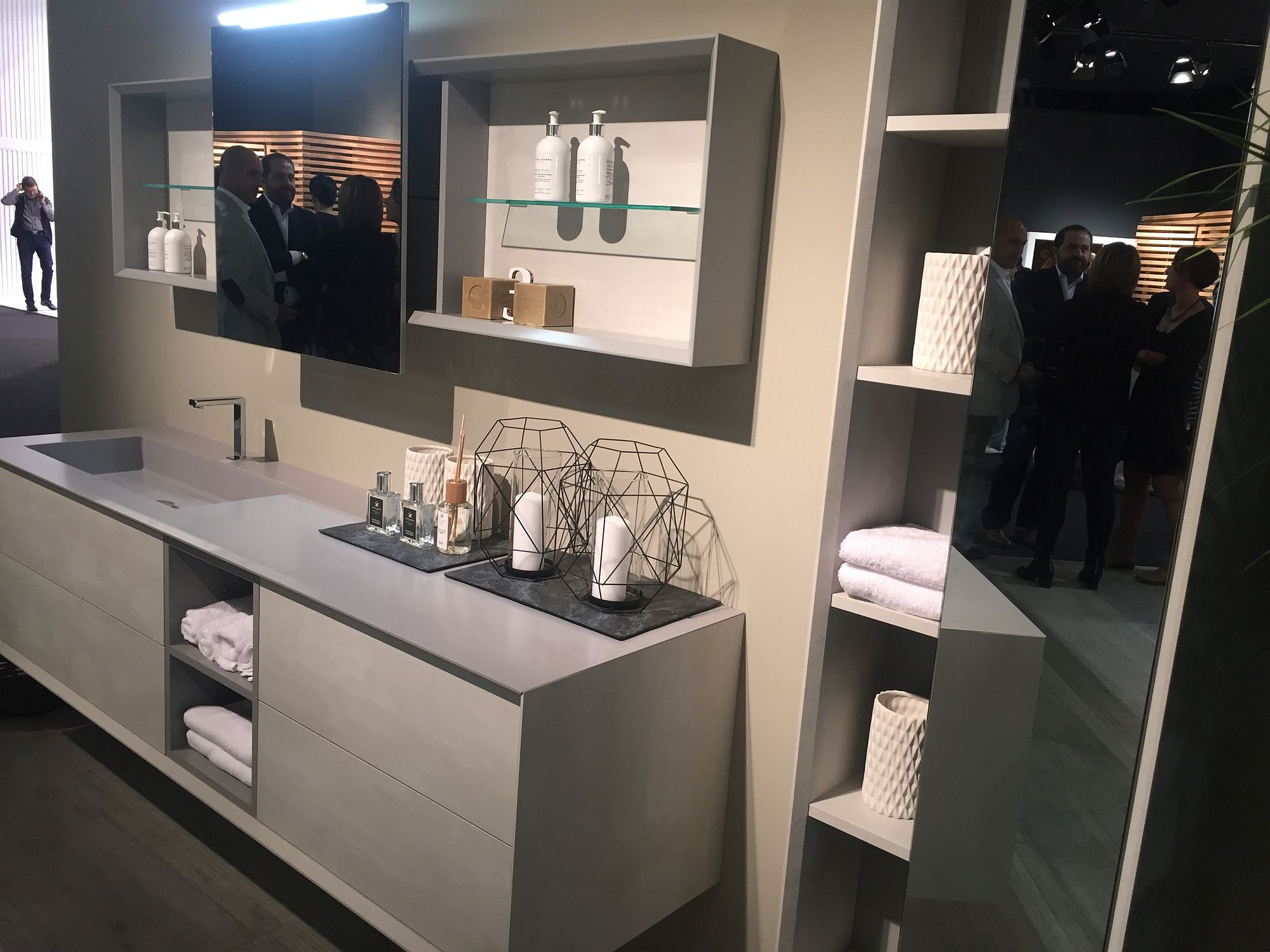 Contemporary bathroom vanity in gray along with tall wall-mounted cabinet