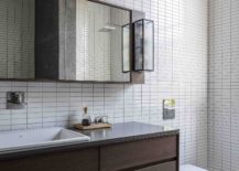 Contemporary-bathroom-with-white-tiles-and-a-wooden-vanity-217x155