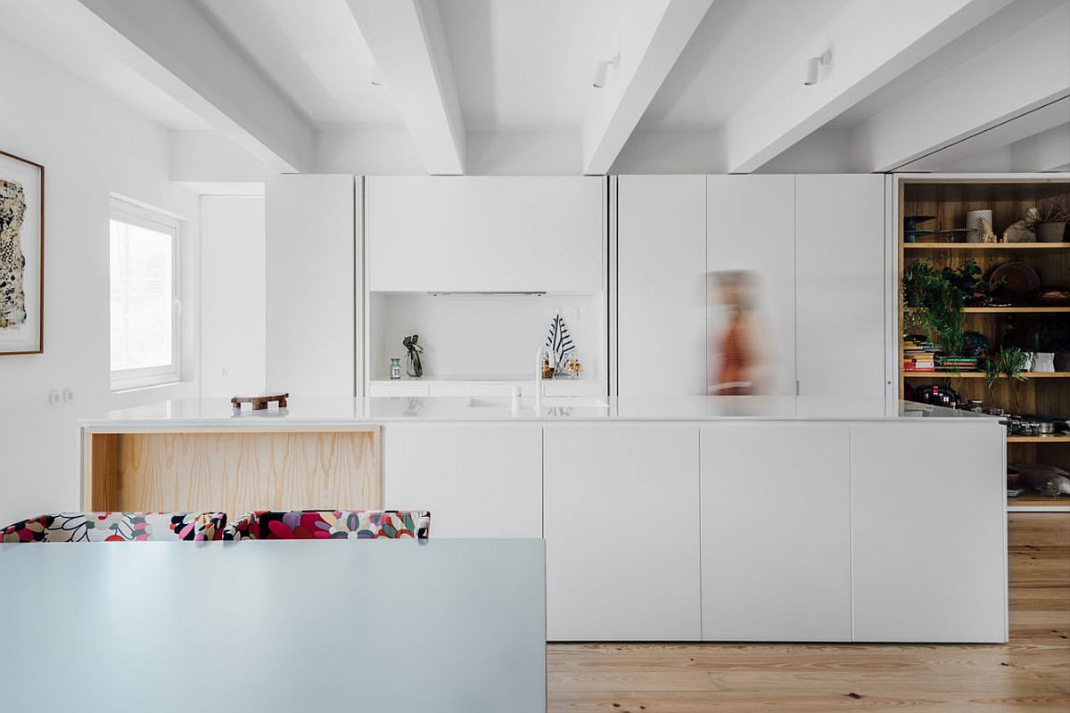 Contemporary kitchen in white with a smart island