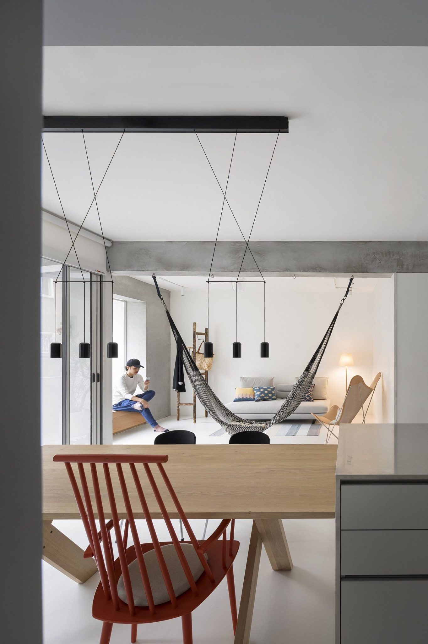 Dark pendants add contrast and sculptural style to the interior