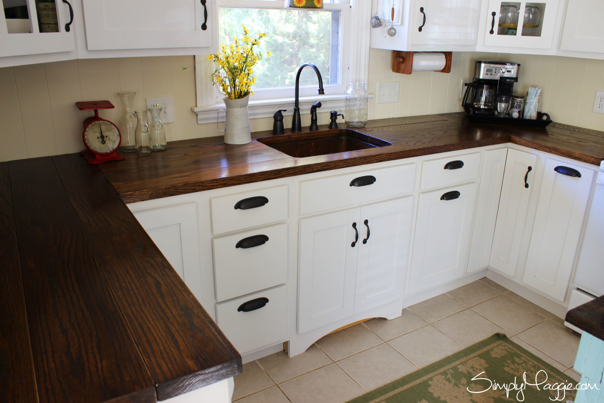 Dark Wooden Countertop Stands Out In A Small Kitchen 