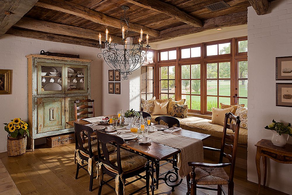 Dreamy farmhouse style dining room with a comfy window seat