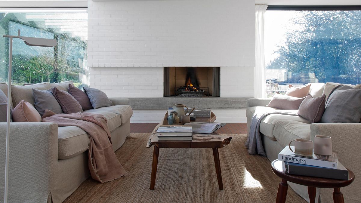 Fireplace-with-wall-of-glass-windows-next-to-it