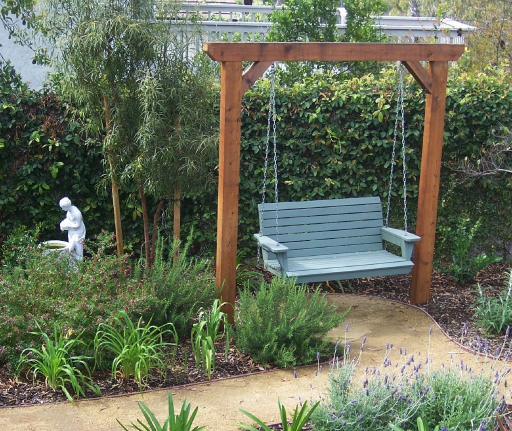 Garden swing with a pathway leading right up to it