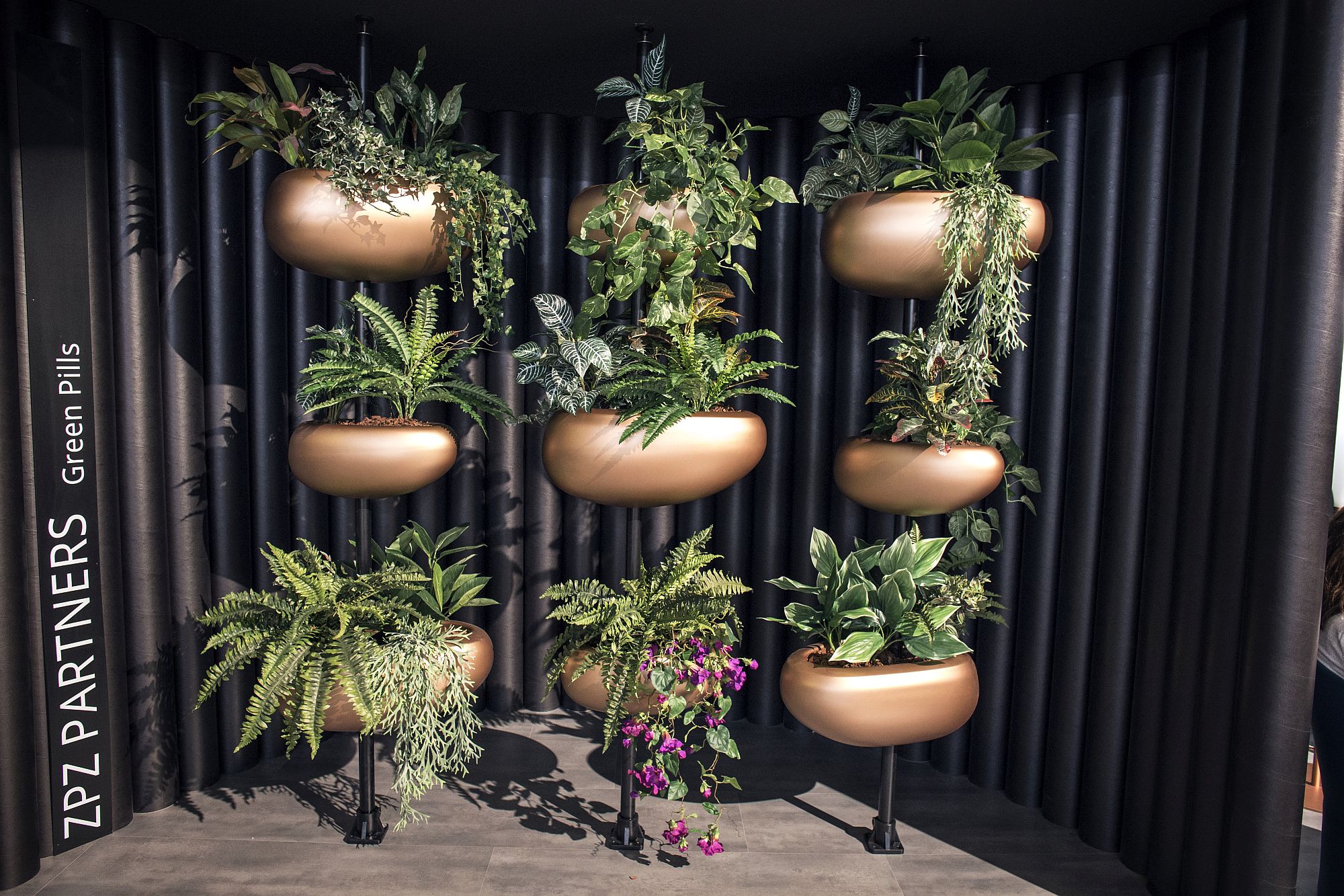 Innovative planters with metallic glint bring greenery to urban spaces