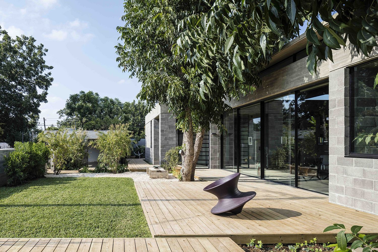 Inviting and private garden with wooden walkways