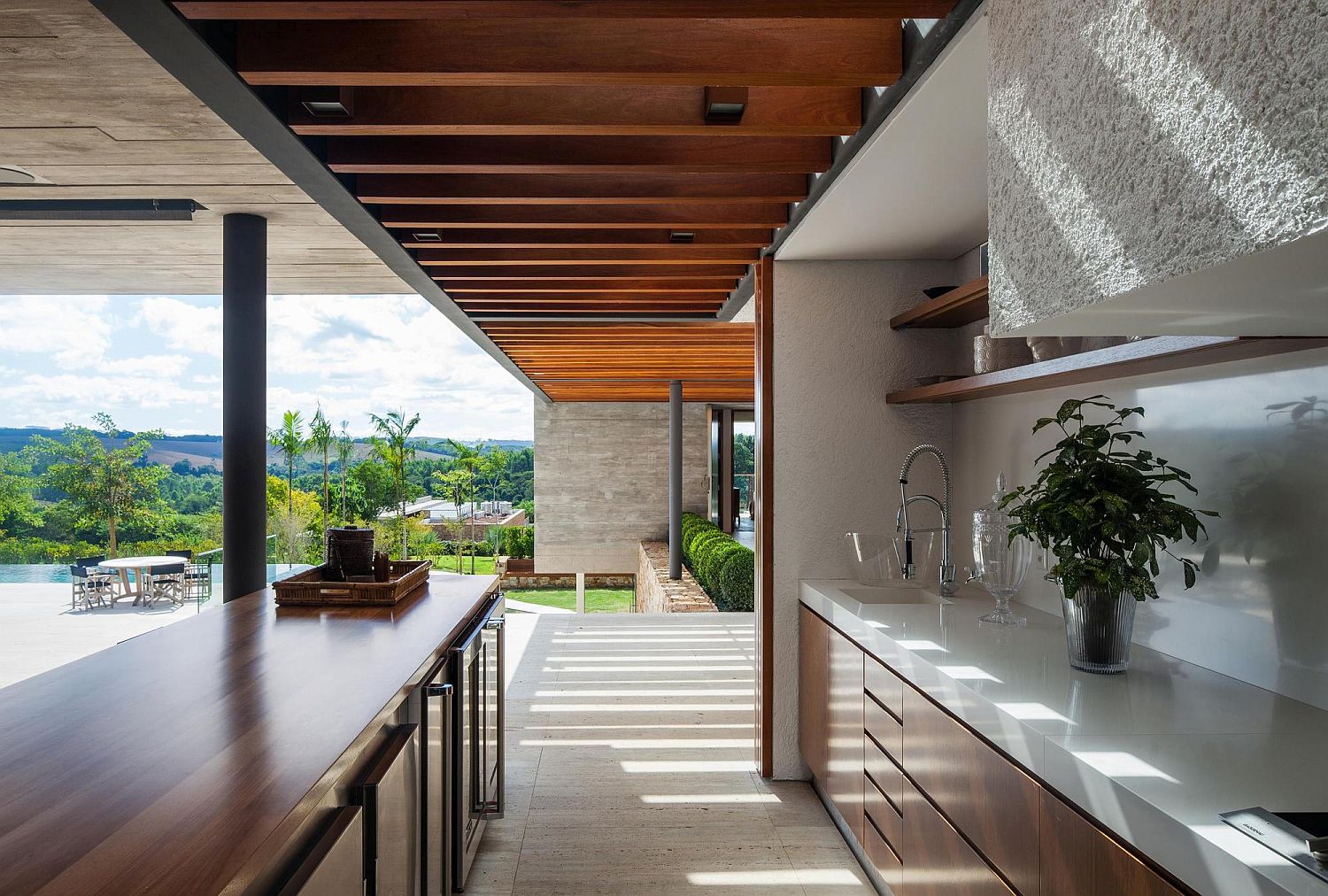 Kitchen connected with the spacious deck and pool area