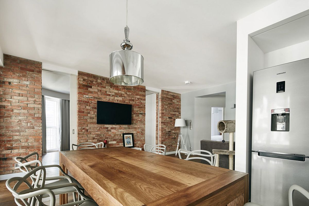 Large dining table in wood and stylish contemporary chairs