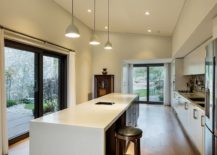 Large-kitchen-in-white-with-a-trio-of-pendants-above-the-island-217x155
