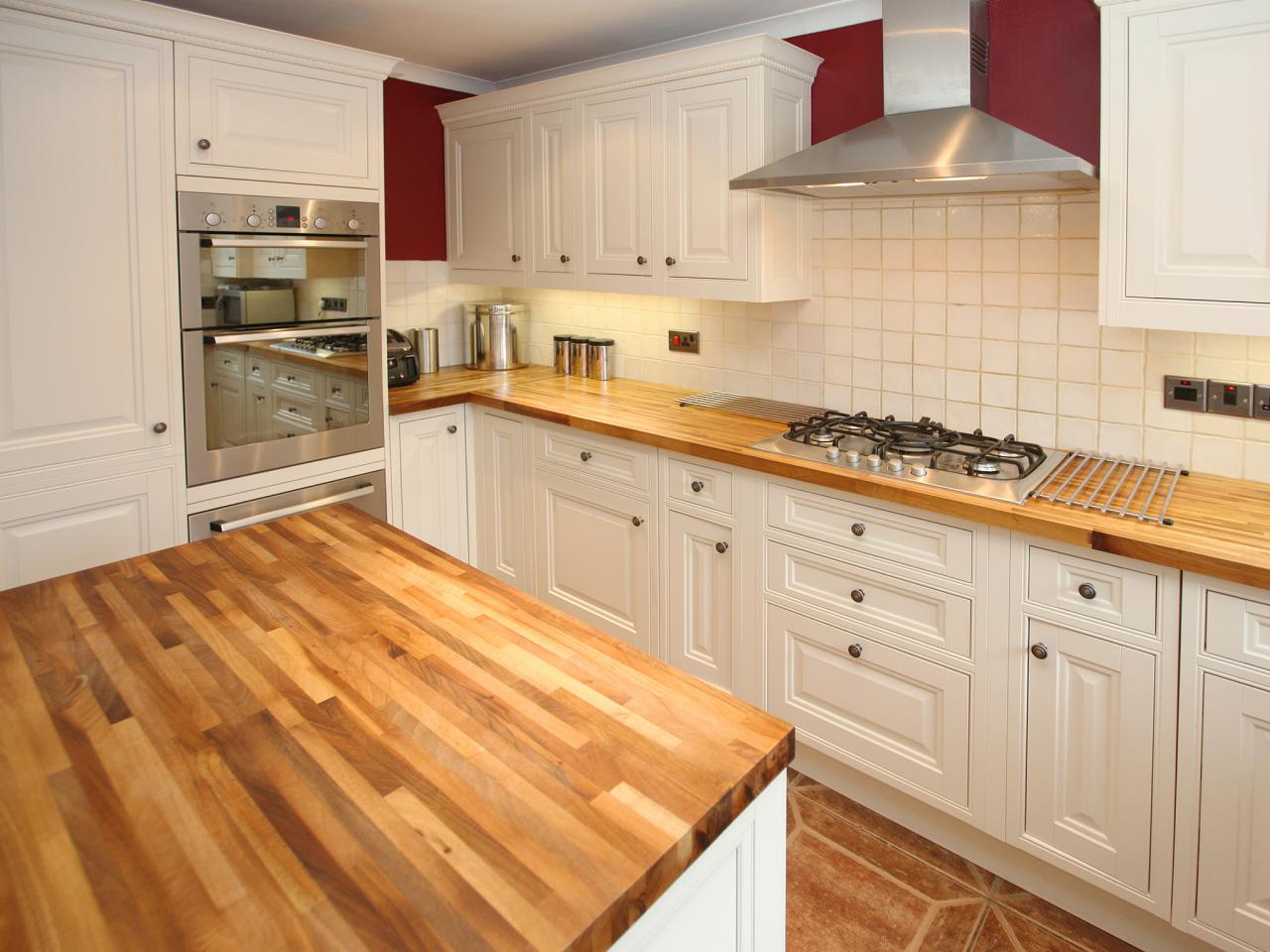 Light wooden countertop adds charm to the elegant and simplistic interior