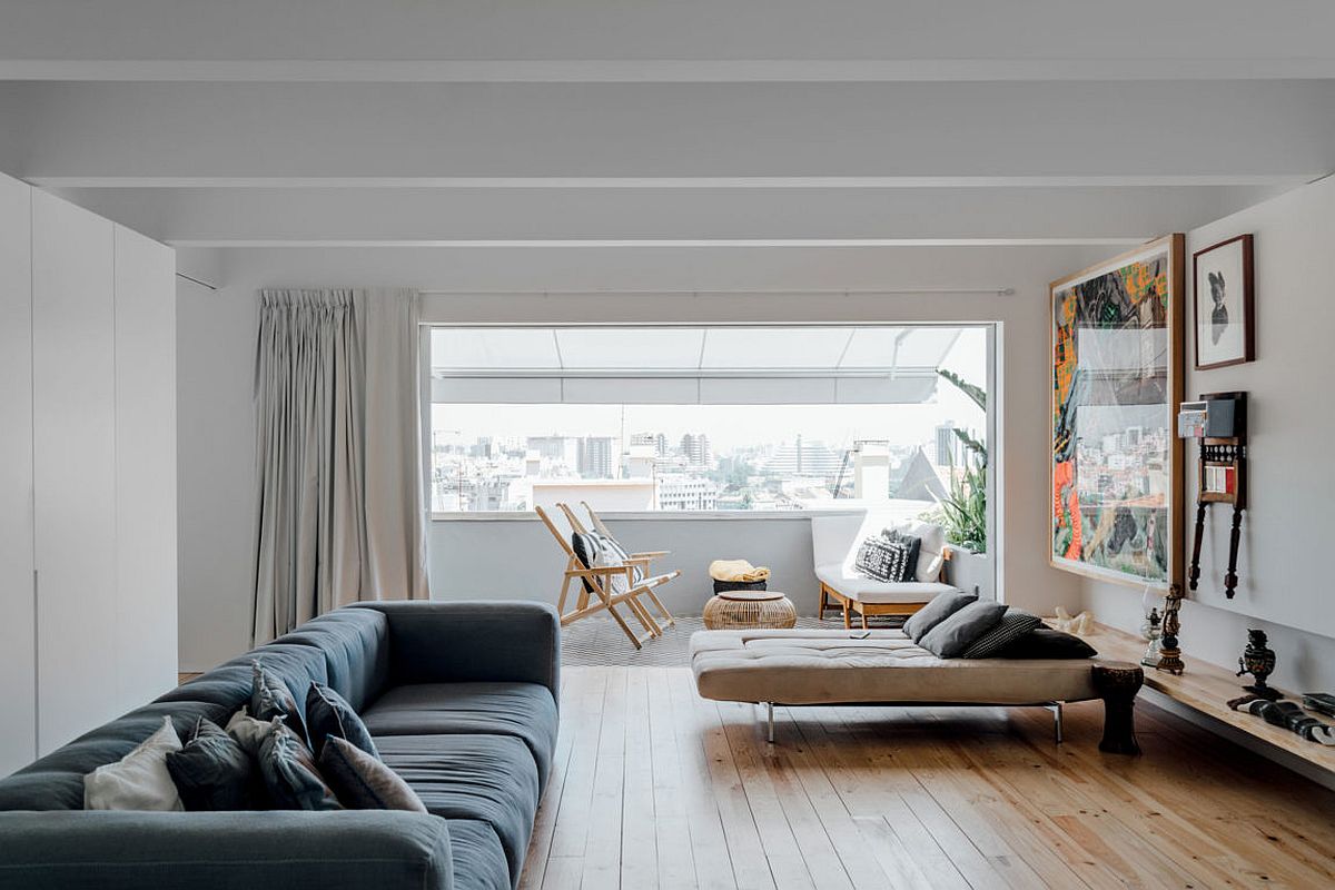 Living-room-connected-with-small-balcony-offers-wonderful-views-of-Lisbon