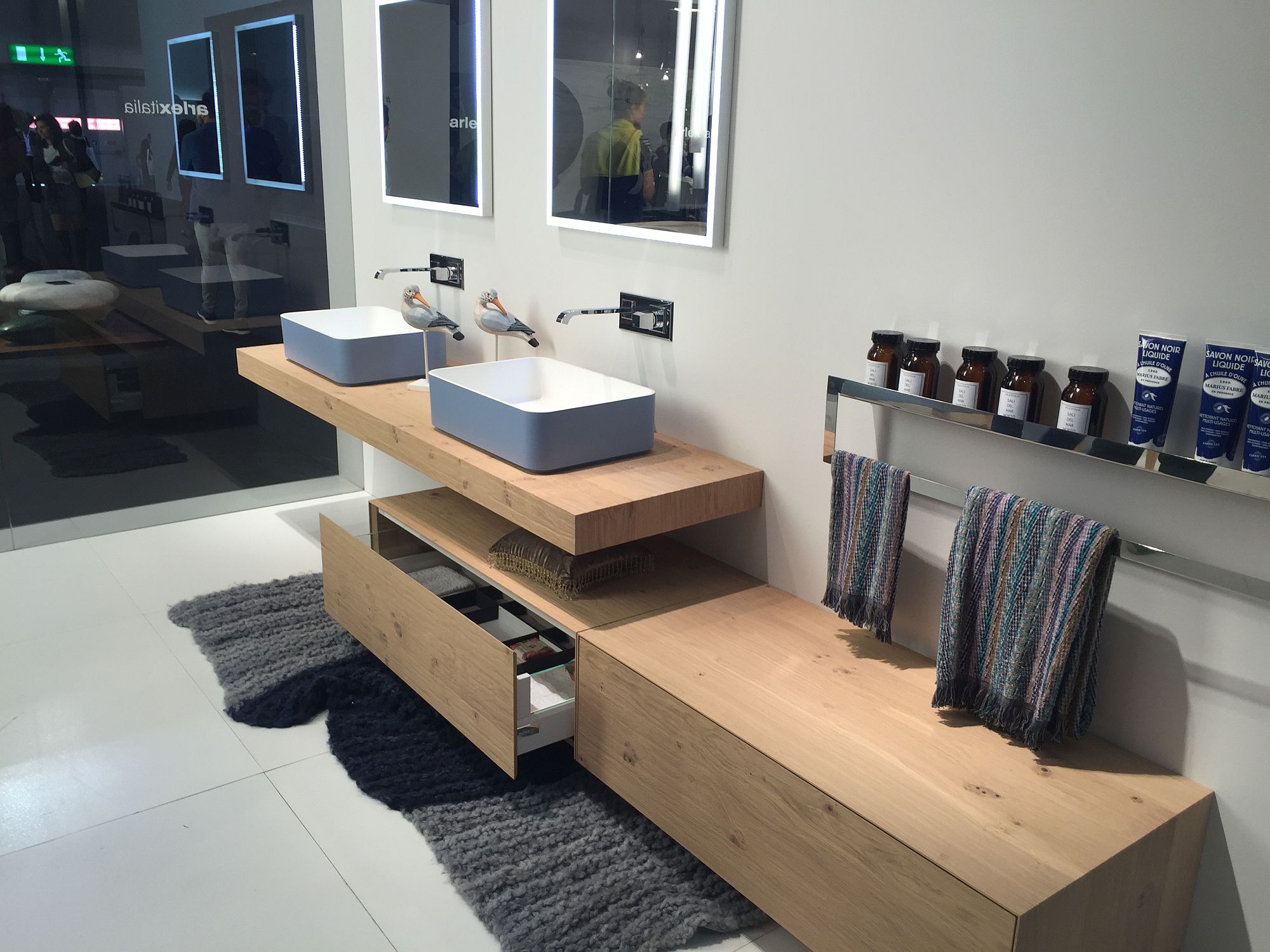 Metallic-towel-rack-combined-with-cool-wooden-floating-units-and-vanity