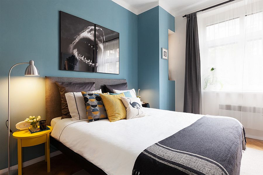 Modern bedroom in blue and white with pops of yellow