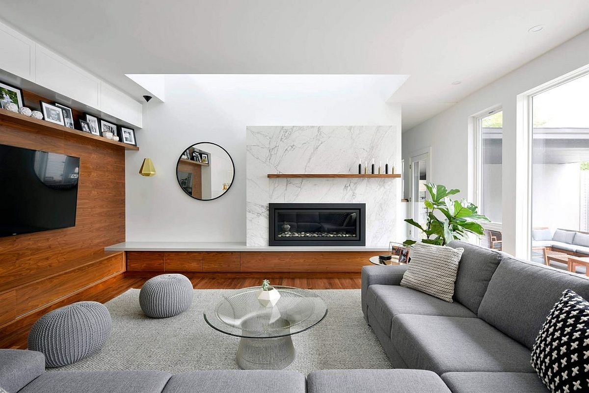 Modern living room with marble fireplace and wooden accent wall