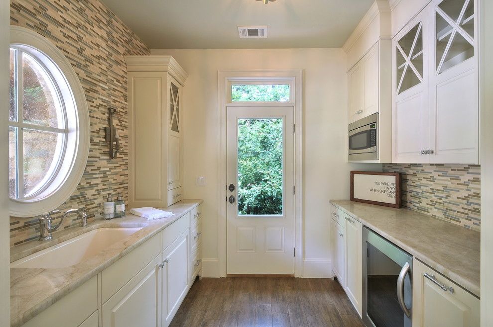 Narrow kitchen benefits from a round window