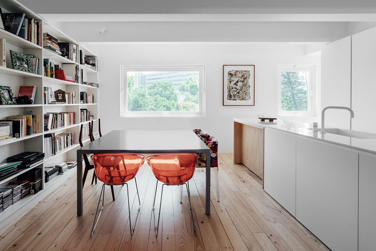 Open shelf offers ample storage space for books in the dining room