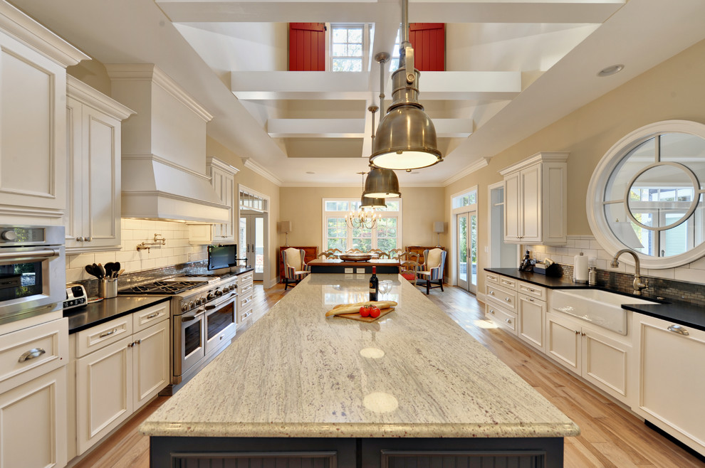 Round window as a focal point in a huge kitchen