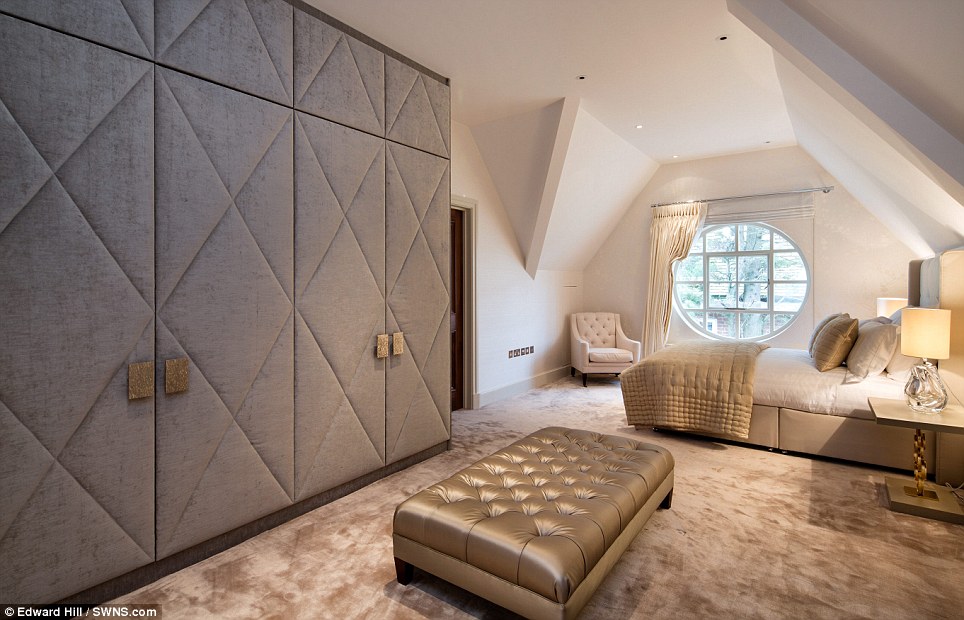 Round window softens a glamorous bedroom