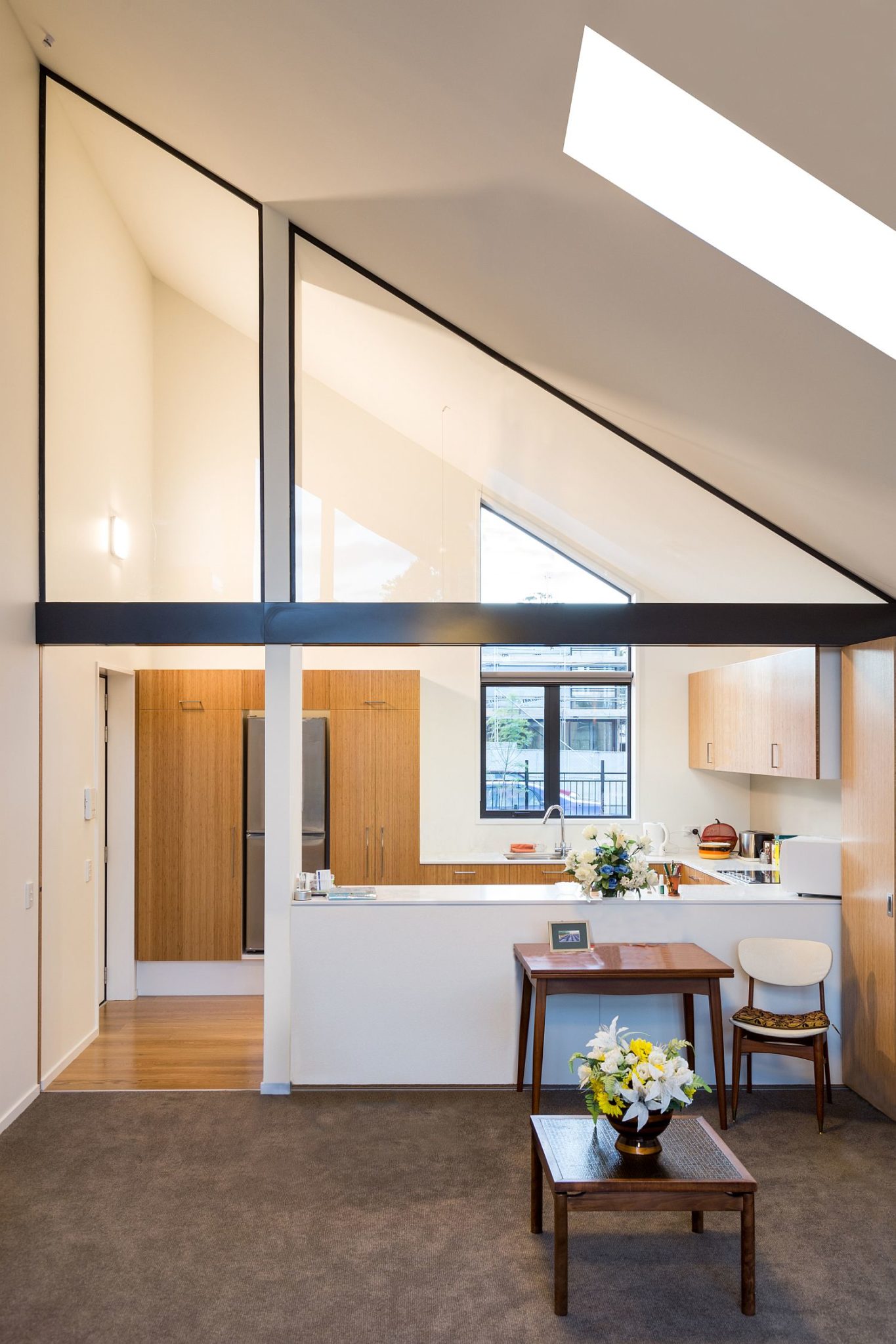 Slanted roof and skylights shape a unique interior