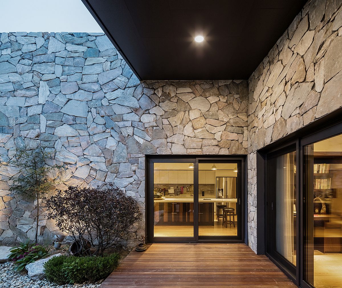 Sliding glass doors, stone and wood come together at the Layers