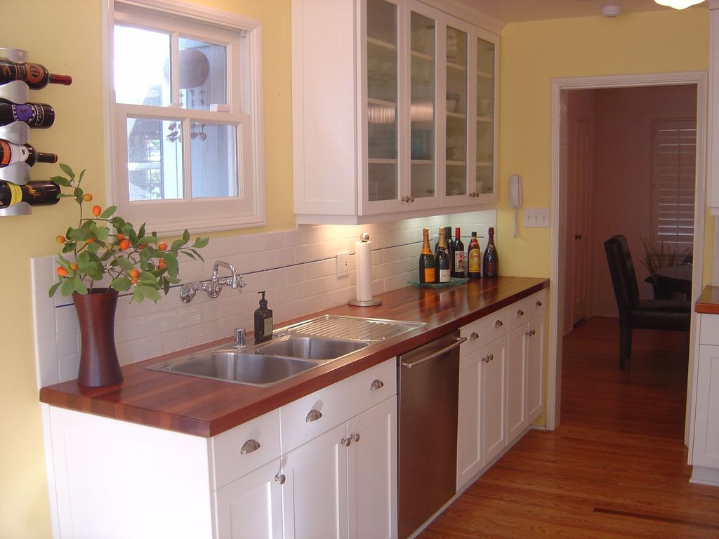 Small and cozy kitchen with a dark wooden countertop