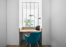 Small-nook-turned-into-home-work-area-with-wooden-desk-and-bright-blue-chair-217x155