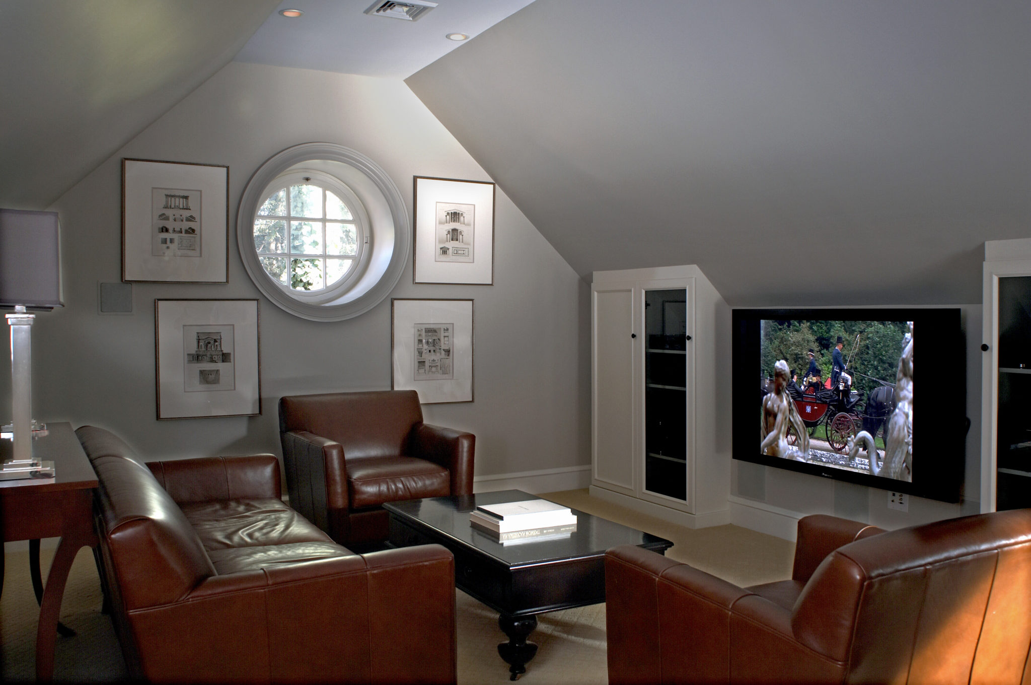 Small round window in a dim and cozy living room