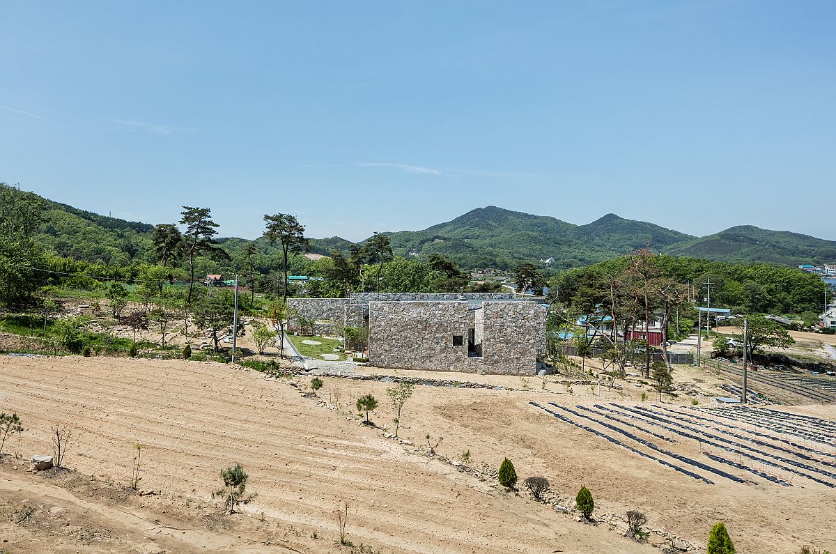 Stone walls allow the home to blend into the landscape